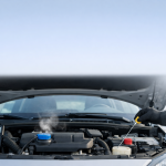 Car with open hood on a cold morning with condensation, a symbol of high fuel consumption when the engine is cold