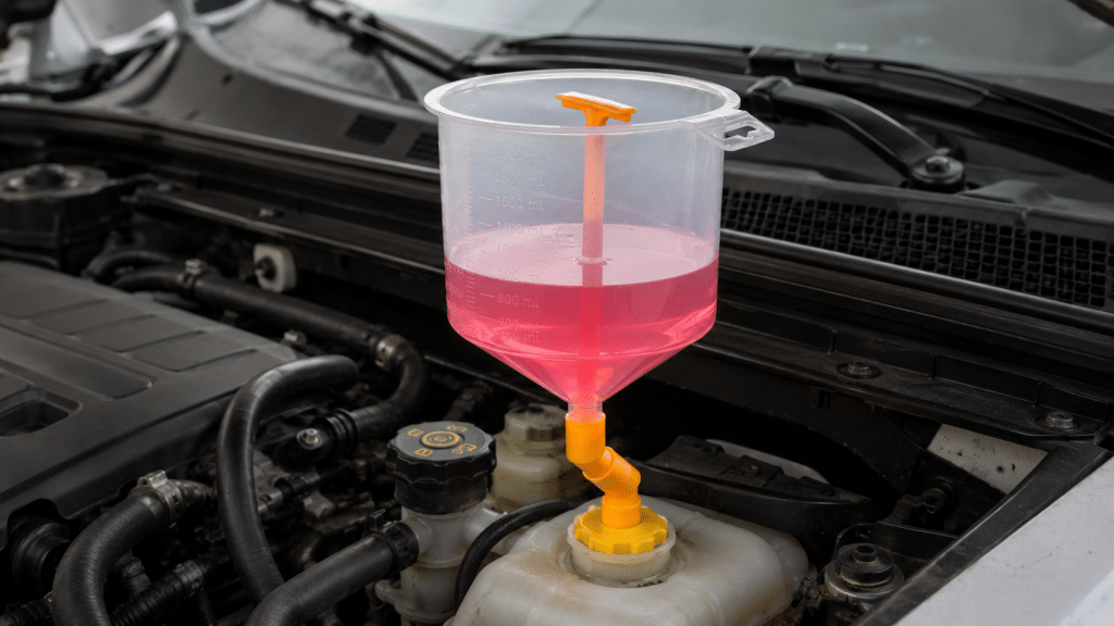 Funnel for topping up car coolant in the engine compartment