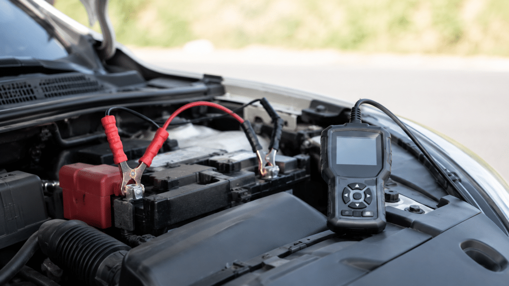 12V car battery tester connected while checking battery condition
